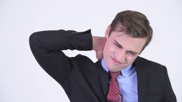 Young Stressed Businessman Having Neck Pain