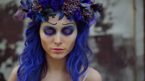 Closeup Portrait of a Girl with Fantastic Blue Makeup Long Colored Eyelashes