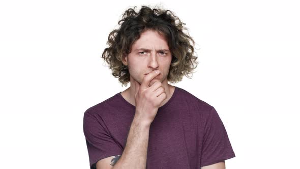 Portrait of Focused Hairy Guy in Casual Tshirt with Brooding Look Thinking Hard or Reflecting About