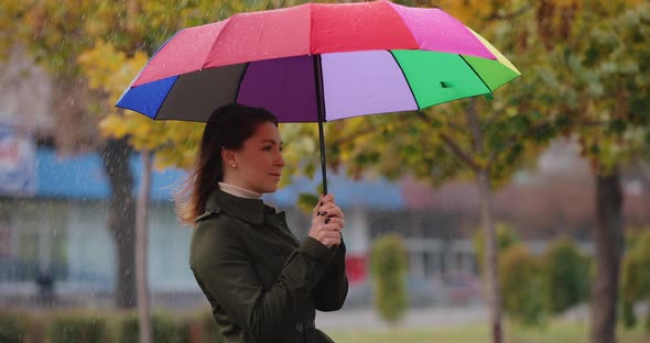 Woman Hiding Under Umbrella From the Rain Slow Motion