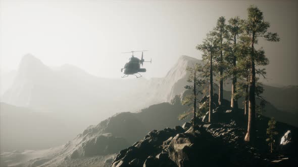 Extreme Slow Motion Flying Helicopter Near Mountain Forest alt