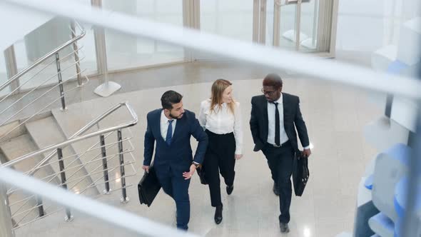 Group of business supervisors going through the hall