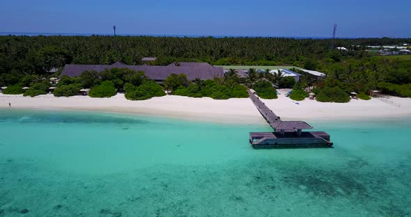 Luxury fly over copy space shot of a white paradise beach and aqua blue water background in high res