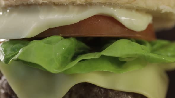 Beef Cheese Burger Display Close Up - Tilt - Top To Bottom