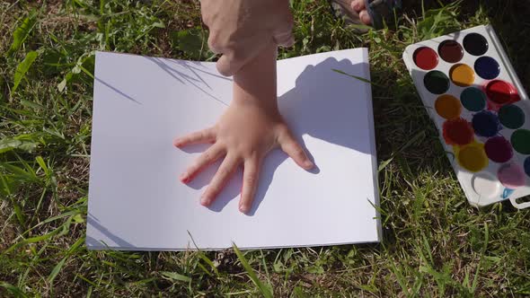 Child Leaves Trail Paint His Palm