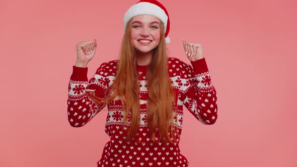 Cheerful Girl in Red Sweater Christmas Santa Shouting Celebrating Success Winning Goal Achievemen