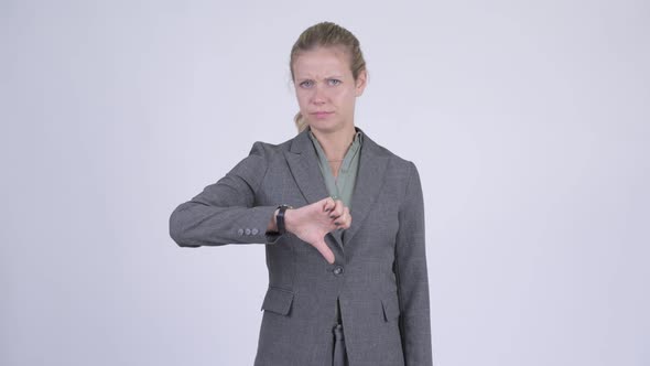 Young Stressed Blonde Businesswoman Giving Thumbs Down