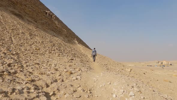 Tourist Hiking Around The Ancient Egyptian Dahshur Red Pyramid In Egypt