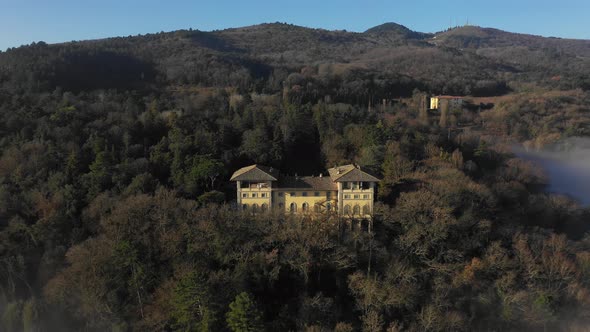 Aerial view of a palace in the forest in Umbria, Italy