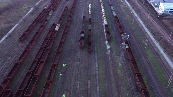 Aerial view of colorful freight trains on the railway station