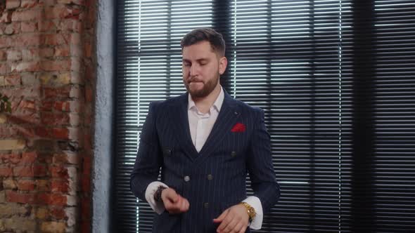 Crypto Millionaire in an Expensive Suit Flips a Bitcoin Coin and Shows It