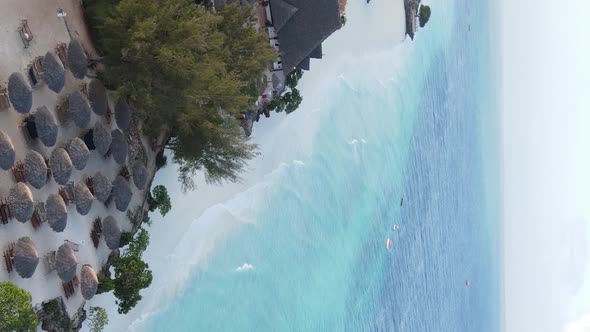 Vertical Video Boats in the Ocean Near the Coast of Zanzibar Tanzania Aerial View