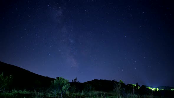 4K Milky way and stars timelapse over mountain background.