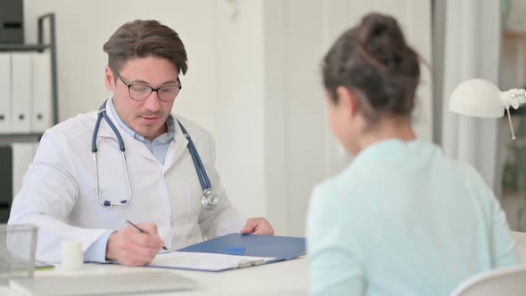 Doctor Discussing and Giving Medical Report To Patient, Treatment