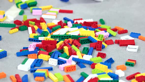 Many Colorful Constructor Blocks on Floor in the Room