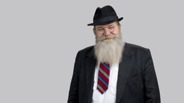 Portrait of Old Senior Man with Beard Wearing Suit with Tie