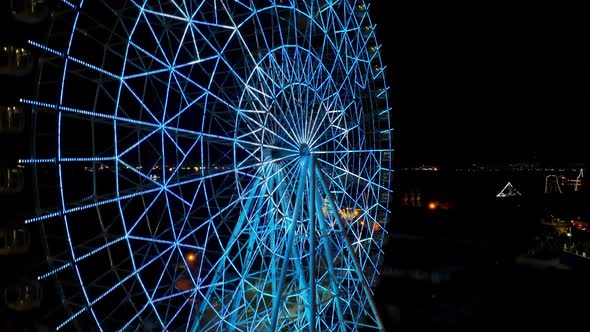 Night landscape of illuminated colorful ferris wheel at Rio de Janeiro Brazil