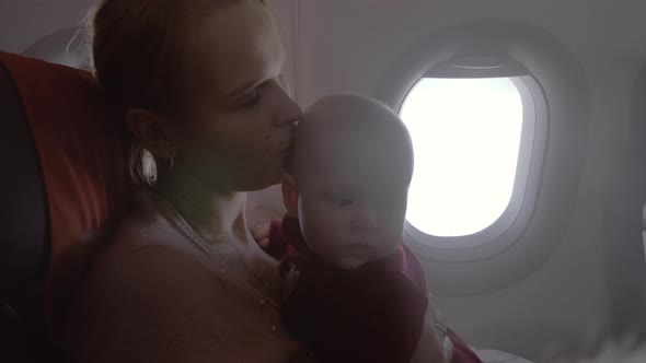 Mum with baby daughter traveling by air