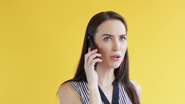 Displeased Woman Speaking on Phone