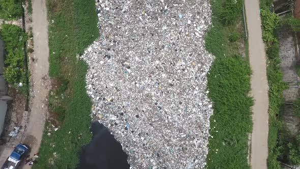 Aerial view of trash floating on a river, Cambodia.