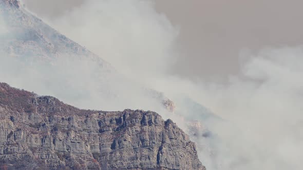 Smoke from forest fire rising up through Provo Canyon