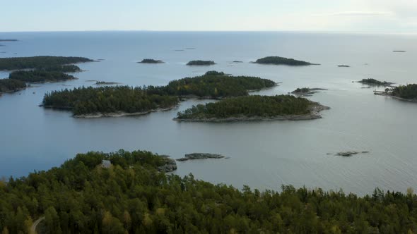 Aerial, tilt up, drone shot, overlooking the archipelago of Porvoo, on the Gulf of Finland, bright,