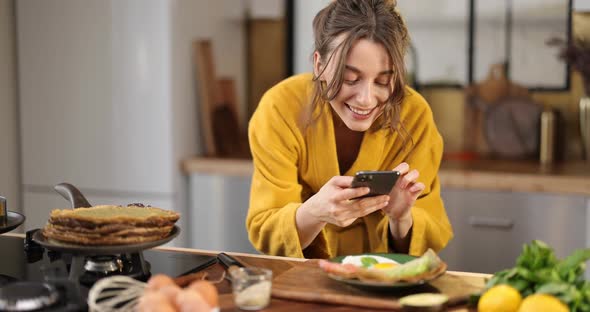 Woman Photographing Breakfast