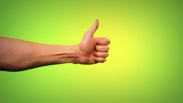 Thumbs Up On Green Background