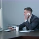 Young Caucasian Businessman Calling with Smartphone and Talking Seriously in Office - VideoHive Item for Sale