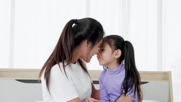 daughter is hugging and kissing her mother. Mother's Day concept.