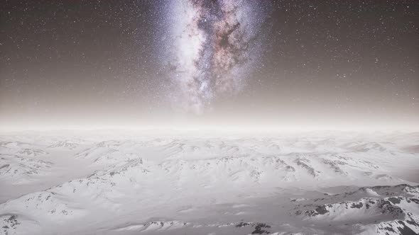 Milky Way Above Snow Covered Terrain alt