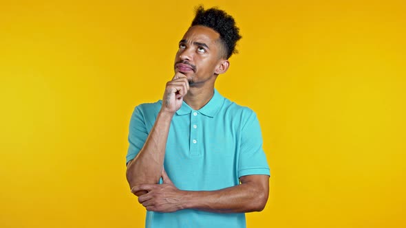 Happy African American Guy Showing Eureka Gesture. Portrait of Young Man Having Idea Moment Pointing