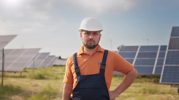 Portrait Ecology Worker in Hard Hat Standing at Solar Panel Field