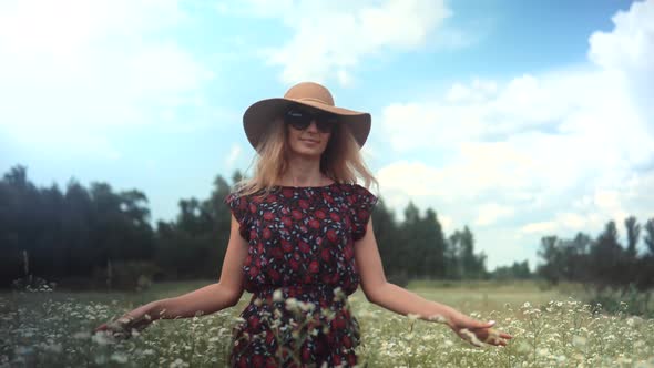 Enjoying Nature At Holidays Weekend. Hands Touches Flowers On Nature. Girl On Meadow. Summer Field.