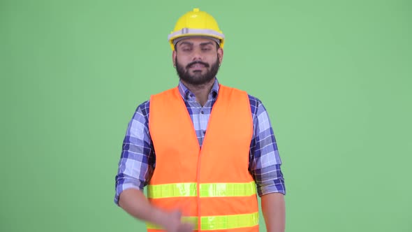 Happy Young Overweight Bearded Indian Man Construction Worker Giving Thumbs Up