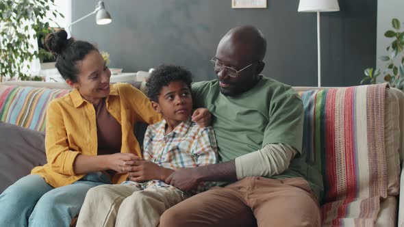 Portrait of Joyous Afro Family on Sofa at Home