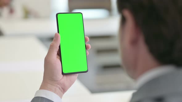 Businessman Using Smartphone with Green Chroma Screen