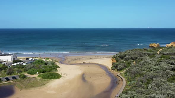 AERIAL DOLLY BACK Torquay Beach, Australia With Surf Lifesaving Clubrooms