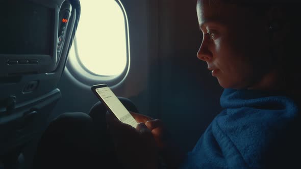 Young girl in airplane