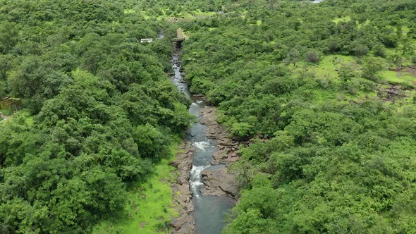 Drone approaching to a small bridge on a Jungle stream in the Western Ghats forest