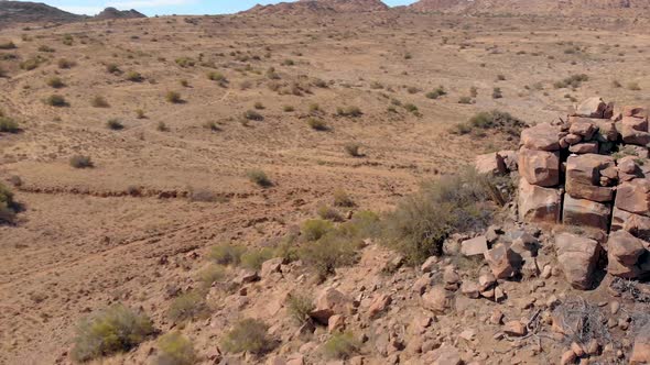 drone reveal shot of mountain bike single track in the karoo desert
