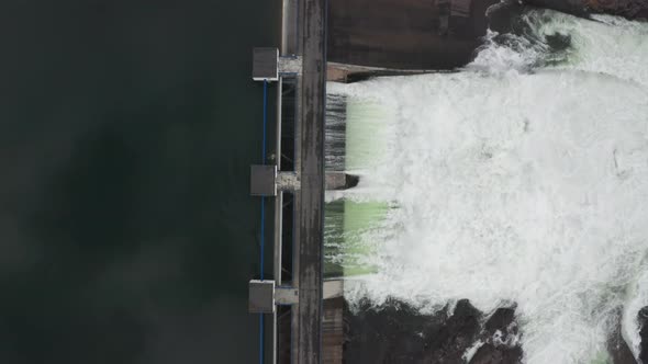 Drone Over Water Flowing Through Hydroelectric Dam