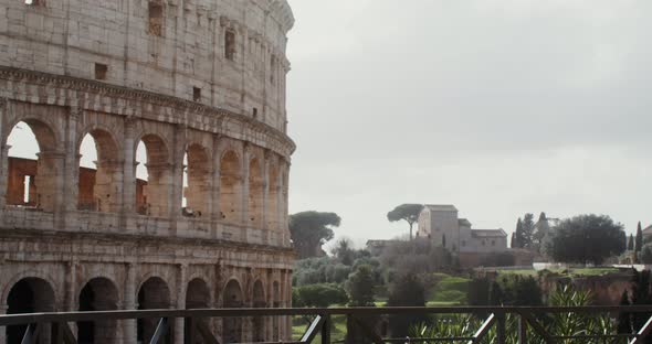 A Woman Comes to the Observation Deck of the Colosseum and Takes a Photo