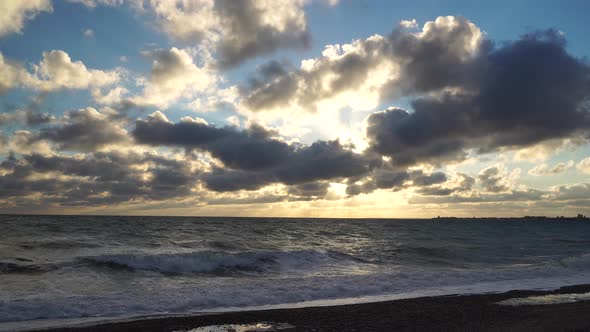 Sand Beach with Azure Stormy Sea Cloudy Sky Background