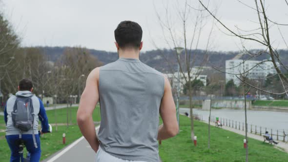 Rear view of a man jogging