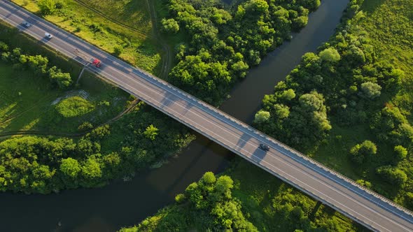 Countryside. A Wide Canal That Flows Between Fields And Forests And A Highway