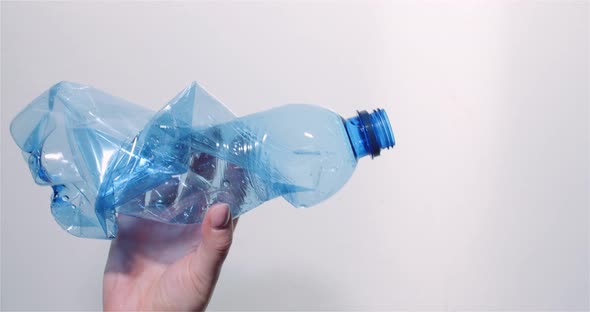 Plastic Recycling - Woman Holding Plastic Bottle Waste in Hand