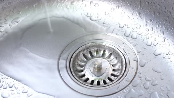 Water Flowing in Kitchen Sink