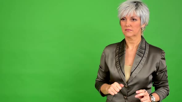 Business Middle Aged Woman Speaks (Talking) - Green Screen - Studio