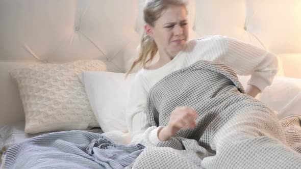 Uncomfortable Sleeping Woman with Back Pain in Bed